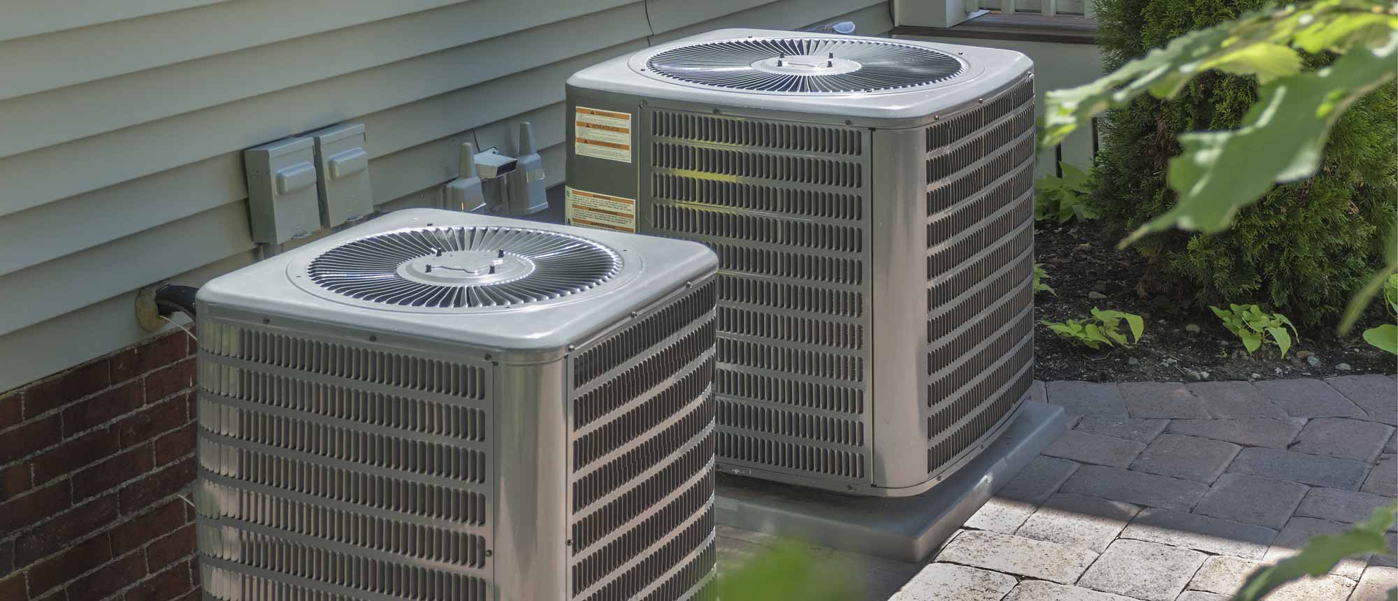 Two Outside Air Conditioning Units from Trane